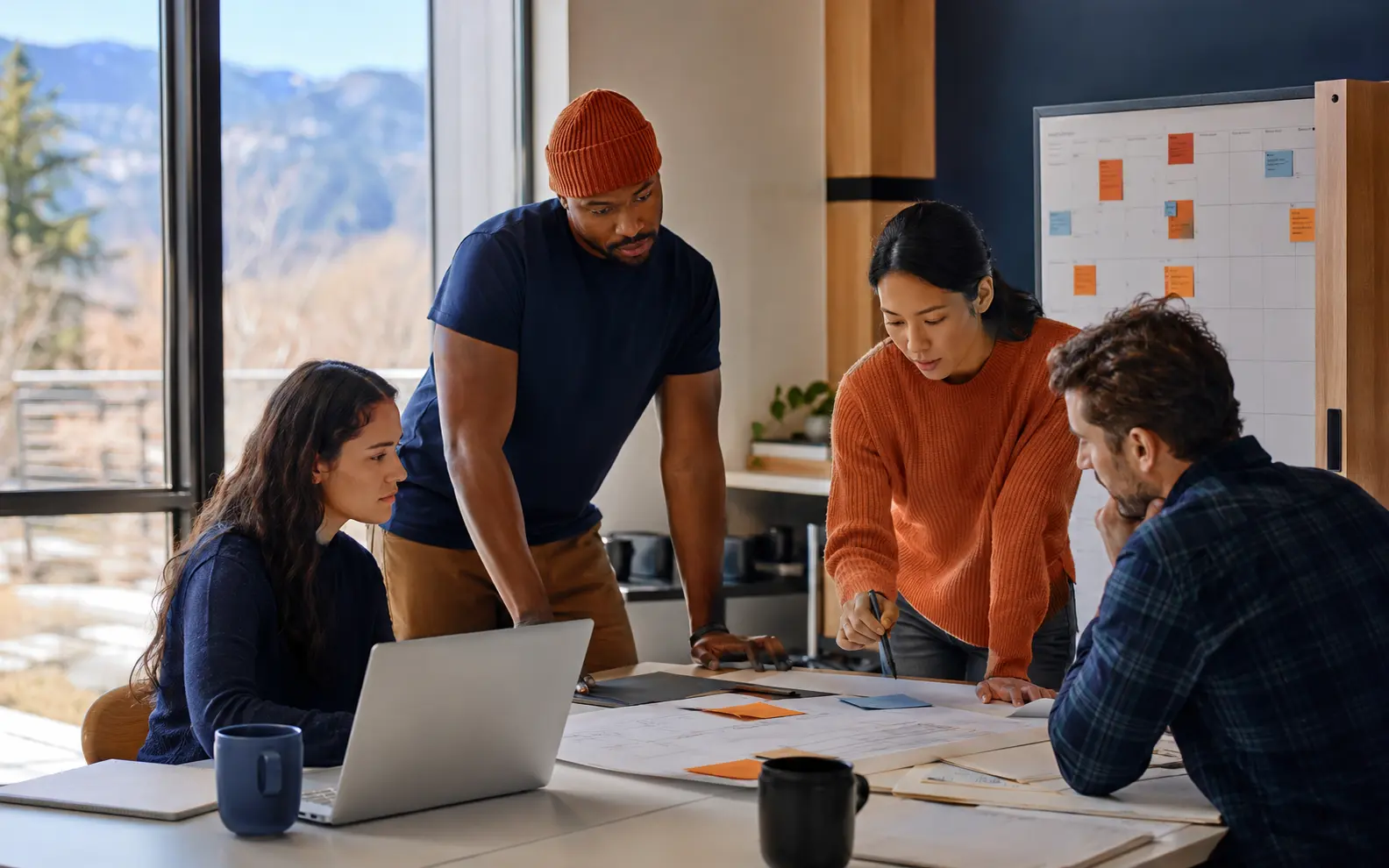 A team coordinating a project schedule in a modern workspace